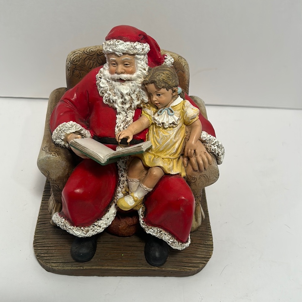 Santa reading to a little girl.  Hobby Lobby statue.